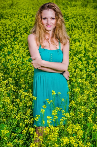 Innocent woman on the yellow field — Stock Photo, Image