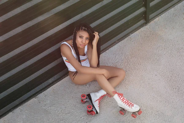Young Woman Sportswear Sitting Skateboard Looking Camera — Stock Photo, Image