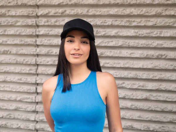 Positive Young Hispanic Woman Blue Top Black Cap Long Dark — Stock Photo, Image
