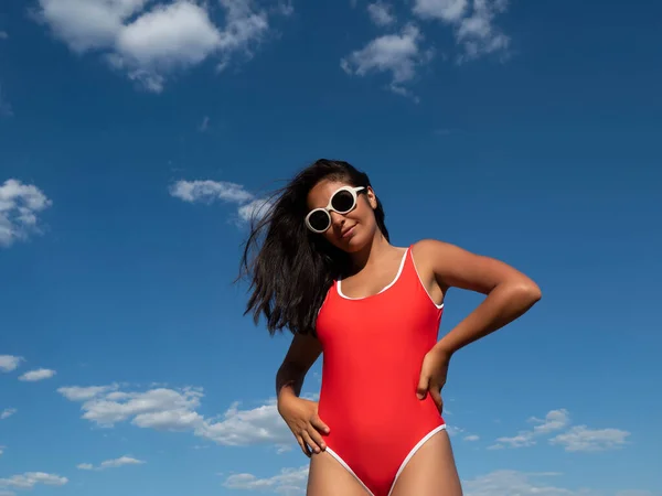 Charming Slender Female Red Swimwear Standing Hands Waist Blue Sky — Stok fotoğraf