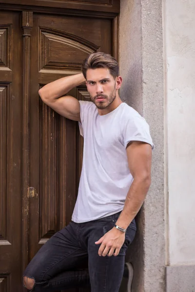 Self Assured Young Male Model White Shirt Ripped Jeans Touching — ストック写真