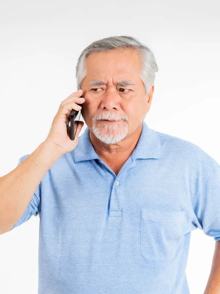 Retired Old Man Standing Talking Phone Serious Expression His Face — стоковое фото