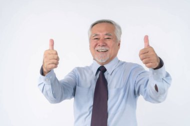  Asian senior businessman , old man with suit giving a thumb up hand on white background with copy space - lifestyle senior male concept