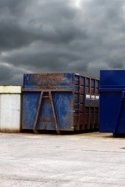 Recycling centre waste bin with a cloudy grey sky — Stock Photo, Image