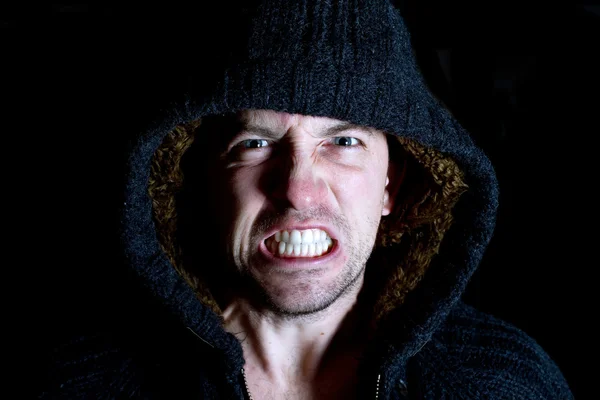 Angry violent man with hood up screaming — Stock Photo, Image
