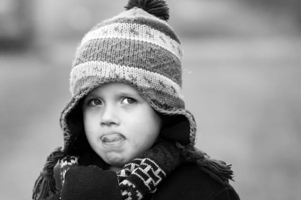 Sad little boy pulling sad expression — Stock Photo, Image