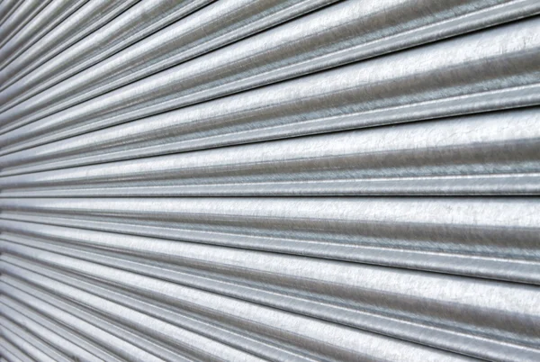 Ezüst fém biztonsági redőnyök bezárt Stock Kép