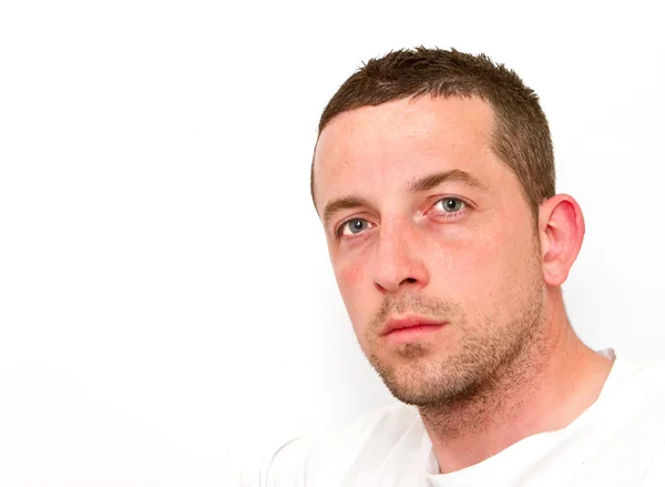 Unshaven Man wearing white t shirt Stock Image