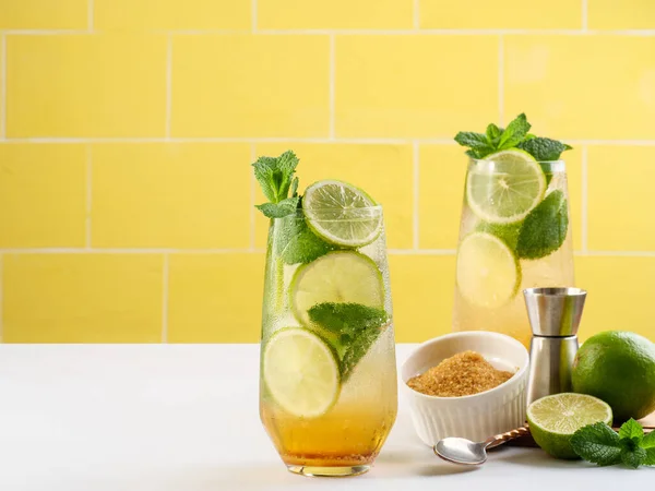 Mojito or virgin mojito long rum drink with fresh mint, lime juice, cane sugar and soda.