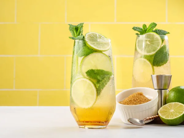 Mojito or virgin mojito long rum drink with fresh mint, lime juice, cane sugar and soda.