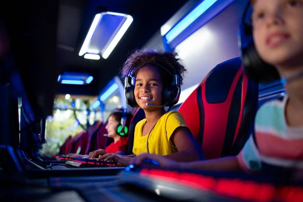 Premium Photo  Girl enjoying her free time by playing video games on  computer in game room