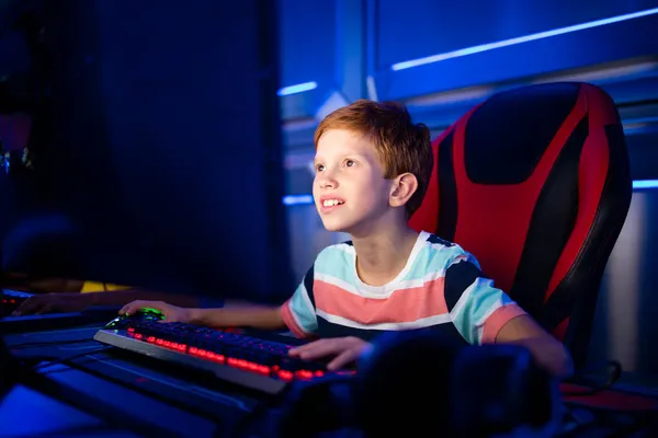 Premium Photo  Girl enjoying her free time by playing video games on  computer in game room