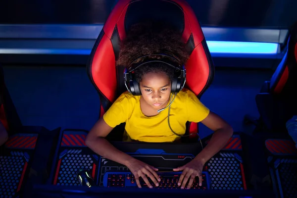 Premium Photo  Girl enjoying her free time by playing video games on  computer in game room