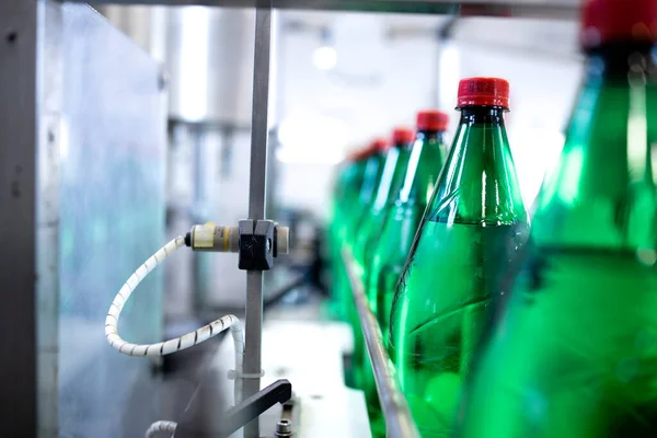 Industrial production of bottled drinking water in beverage factory.