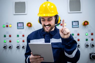 Portrait of an intelligent factory worker having brilliant idea.