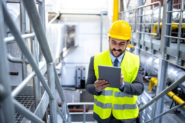 Factory Manager Elegant Suit Hardhat Checking Results Tablet Computer Production — Foto Stock