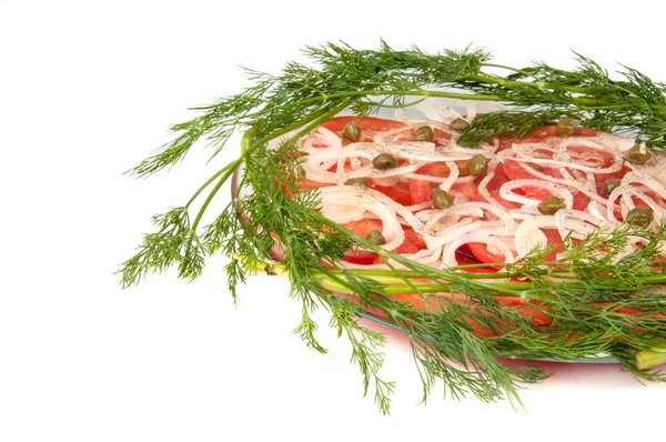 Sliced ​​tomatoes and onions on a plate — Stock Photo, Image