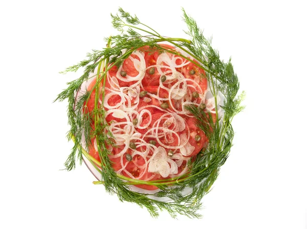 Sliced ​​tomatoes and onions on a plate — Stock Photo, Image