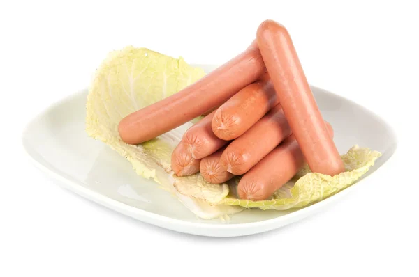 Fresh sausages on a plate — Stock Photo, Image