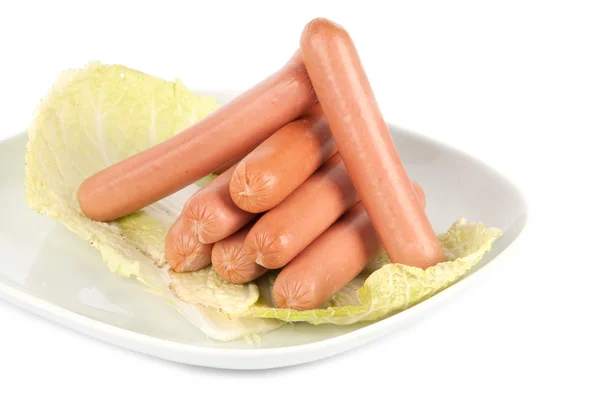 Fresh sausages on a plate — Stock Photo, Image