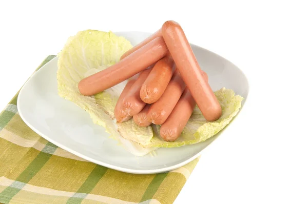 Fresh sausages on a plate — Stock Photo, Image