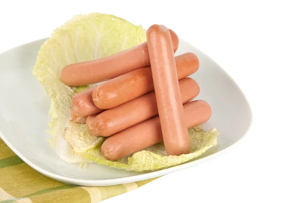 Fresh sausages on a plate — Stock Photo, Image