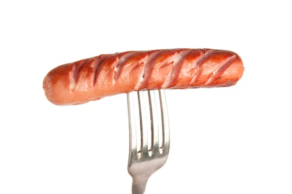 Grilled sausage on a fork — Stock Photo, Image