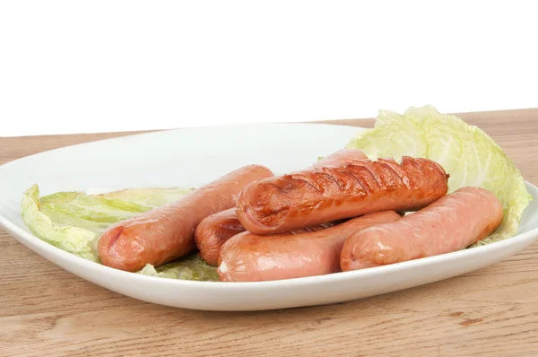 Grilled sausages on a plate Stock Photo