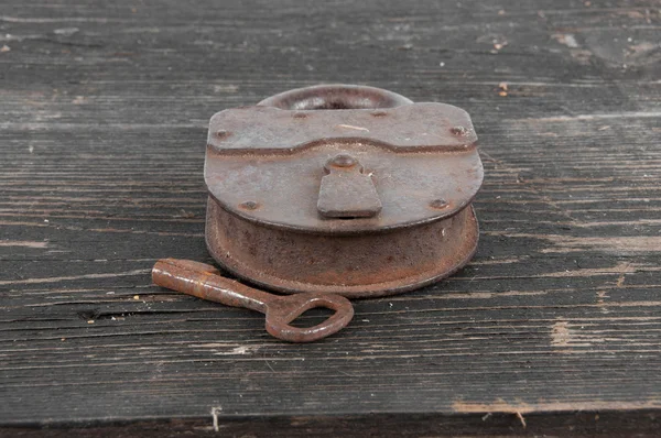 Old lock with a key — Stock Photo, Image