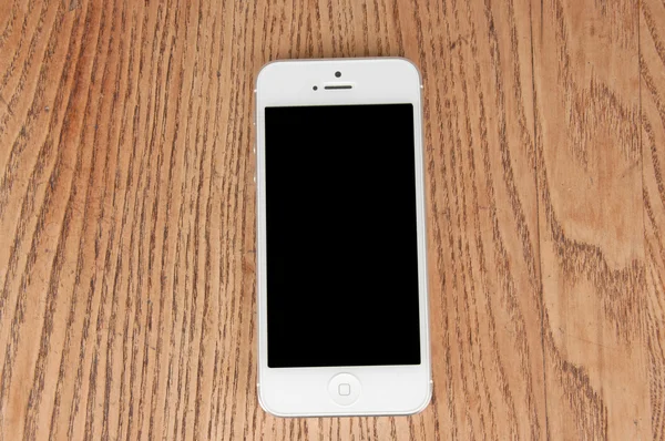 Close-up white phone on the table — Stock Photo, Image