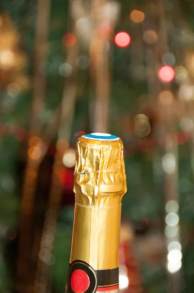 Bir şişe şampanya ve bokeh — Stok fotoğraf