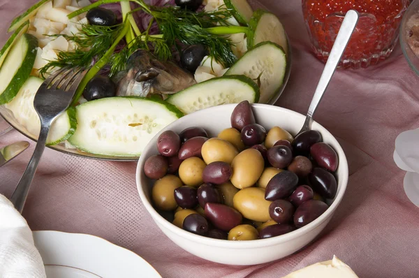 Potatoes with herring and olives — Stock Photo, Image