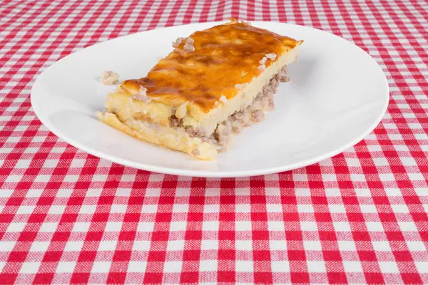 Potato pie on a white plate — Stock Photo, Image