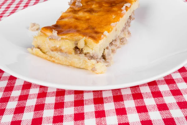 Potato pie on a white plate — Stock Photo, Image