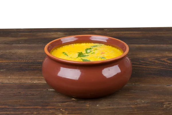 Cheese soup in a brown bowl — Stock Photo, Image