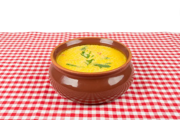 Cheese soup in a brown bowl Royalty Free Stock Photos