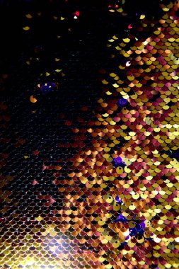 Işık efektli altın parlak pulların arkaplanı