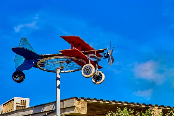 Homemade Weathervane Plane Bicycle Wheel Colorful Boards Blue Sky Sunny — Stock Photo, Image