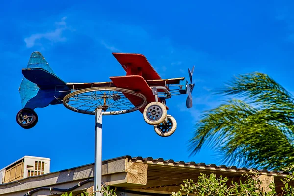 Homemade Weathervane Plane Bicycle Wheel Colorful Boards Blue Sky Sunny — Stock Photo, Image