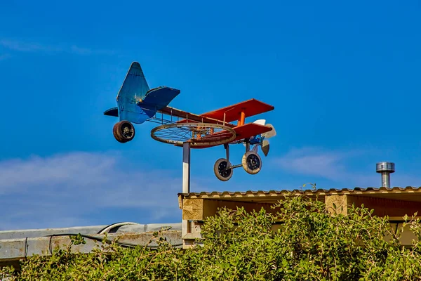 Homemade Weathervane Plane Bicycle Wheel Colorful Boards Blue Sky Sunny — Stock Photo, Image