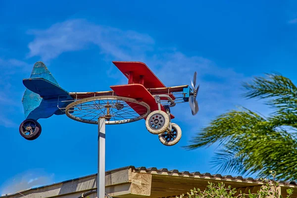 Homemade Weathervane Plane Bicycle Wheel Colorful Boards Blue Sky Sunny — Stock Photo, Image