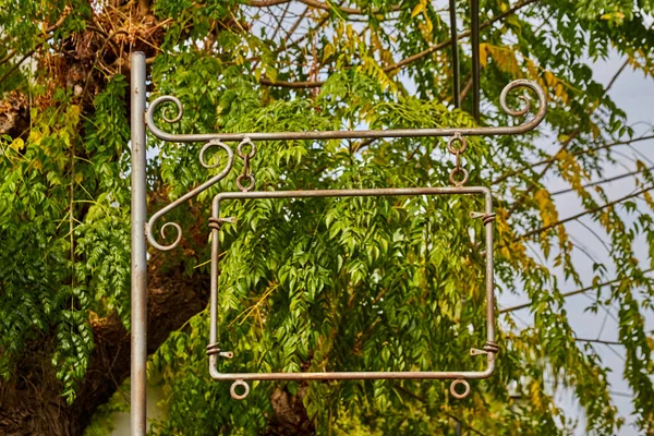 Empty Iron Retro Frame Sign Pole Background Green Foliage Tree — 스톡 사진