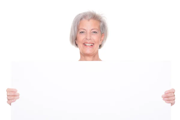 Donna anziana con segno — Foto Stock
