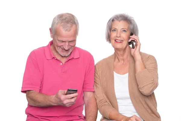 Senior couple with smartphone — Stock Photo, Image