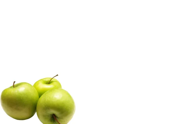 Gröna äpplen på en vit bakgrund — Stockfoto