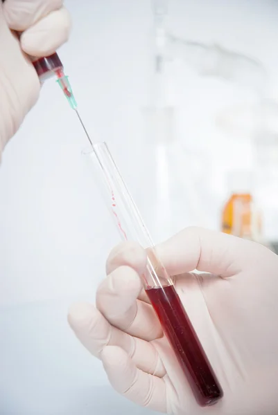 Test-tube with blue liquid isolated — Stock Photo, Image