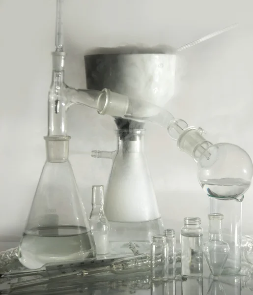 Laboratory glassware over white — Stock Photo, Image