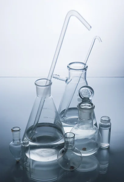 Laboratory glassware over white — Stock Photo, Image