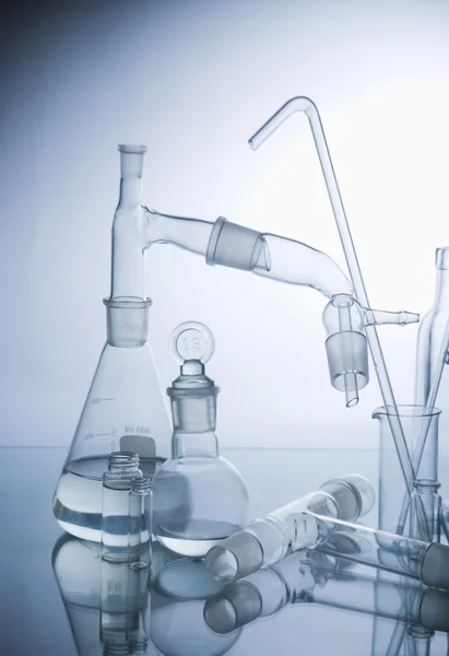 Laboratory glassware over white — Stock Photo, Image