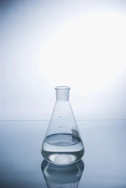 Test-tube with blue liquid isolated — Stock Photo, Image